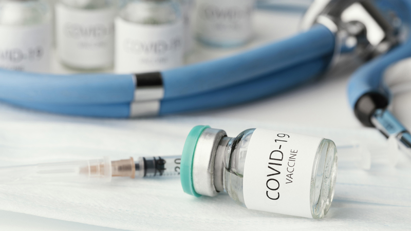 assortment with coronavirus vaccine bottle